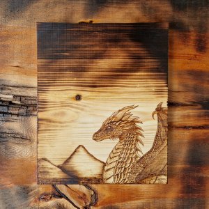 Dragon pyrography on pinewood