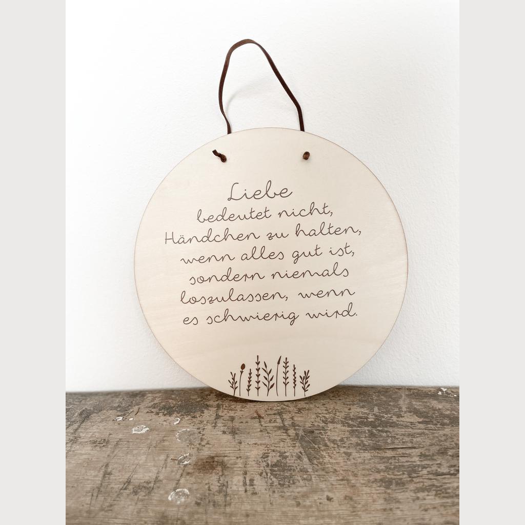 Holzschild „Liebe bedeutet nicht