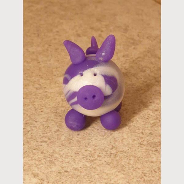 Glücksschweinchen aus Fimo lila/weiß